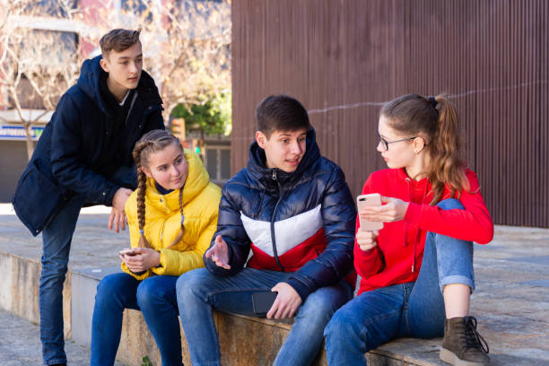 istock Teenagers gathering outdoors 1239349611