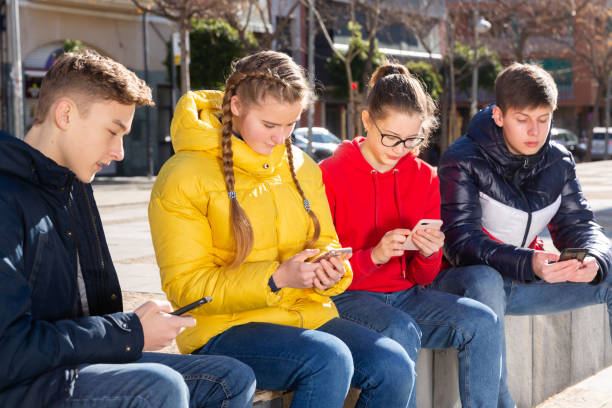istock Teens outdoor with smartphones 1239349618