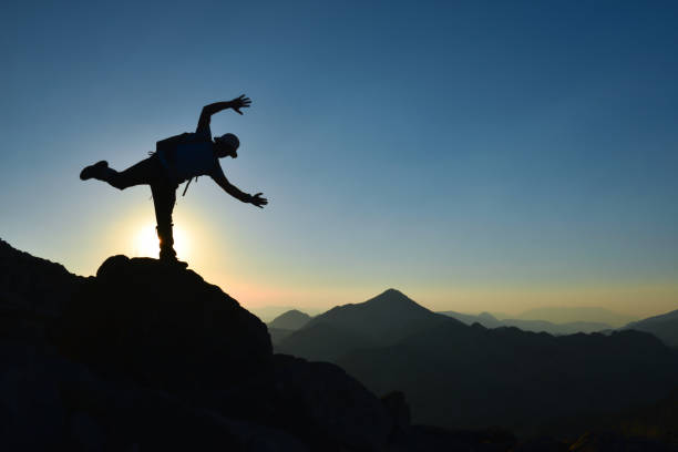 istock successful and joyful person at the summit 1239362480