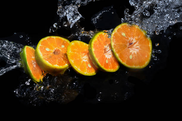 istock Oranges cut into slices on the water surface 1239387458