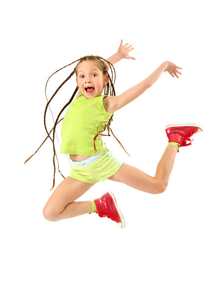 istock Little girl with crazy braids high jumping on white 123939093