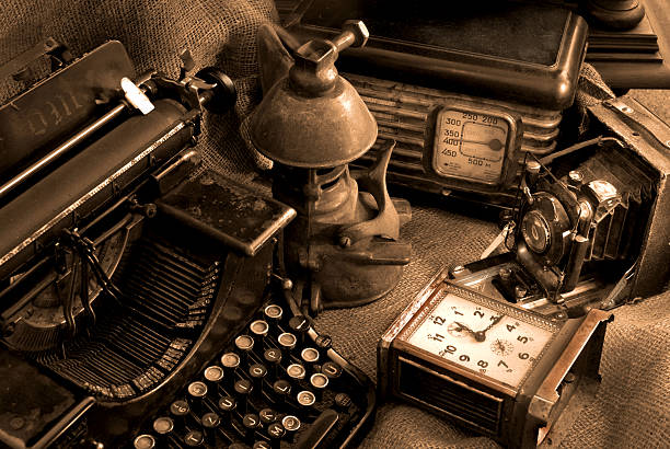 vintage ainda vida - typewriter sepia toned old nostalgia - fotografias e filmes do acervo