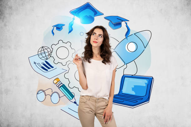Portrait of dreamy young European woman with wavy long hair in casual clothes standing near concrete wall with creative education sketch. Concept of graduation and career choice