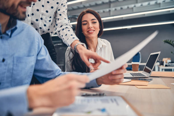 istock Happy co-workers talking about business development opportunities 1239434722