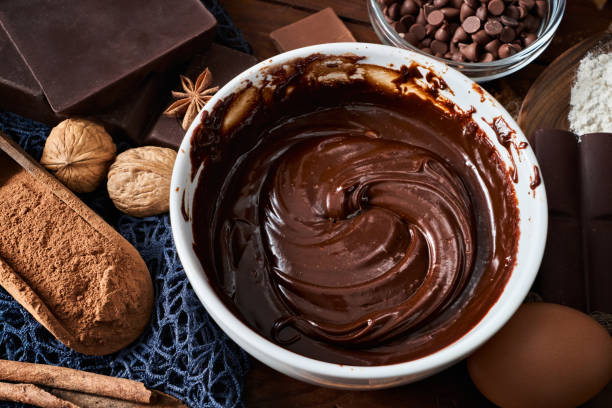 istock Chocolate mousse making with ingredients in rustic kitchen and low key 1239440354