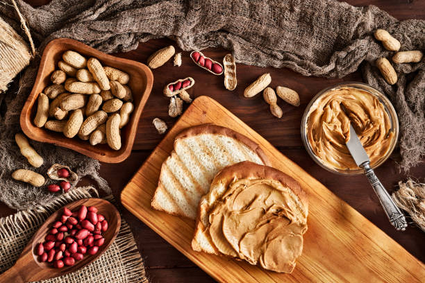 Toast with peanut butter on vintage table set in rustic kitchen