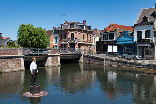 Amiens, France - May 29 2020: The Dodane bridge spanning the Somme river in the Saint-Leu district.