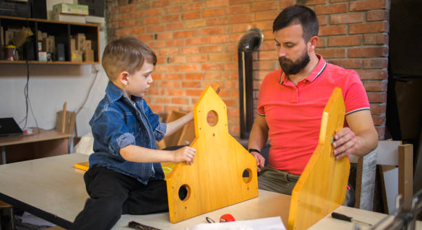 istock Father and Son Making a Birdhouse 1239460967