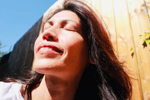 istock Woman relaxing in the garden 1239464320