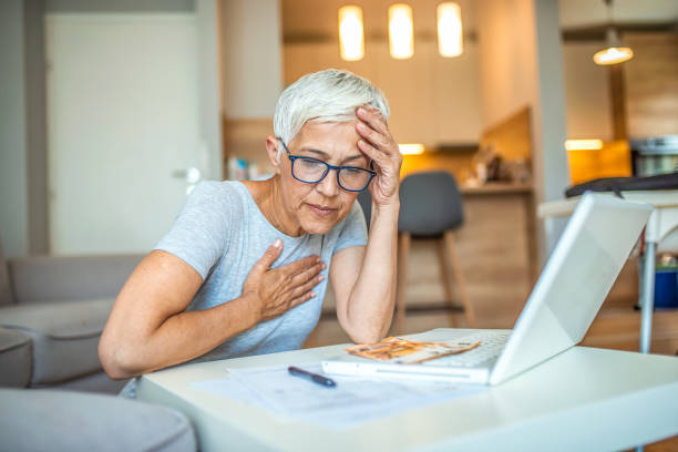 istock Worried senior woman using laptop. 1239464875