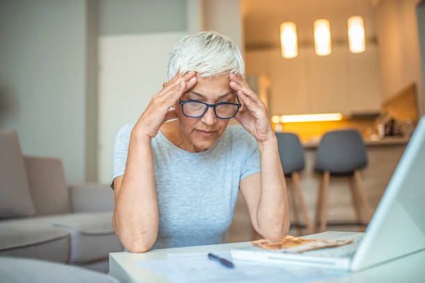 istock Worried senior woman using laptop. 1239465514