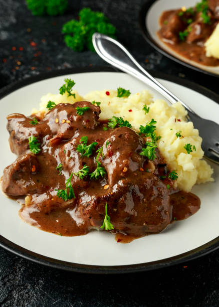 istock Fried Liver in gravy with mashed potato 1239466123