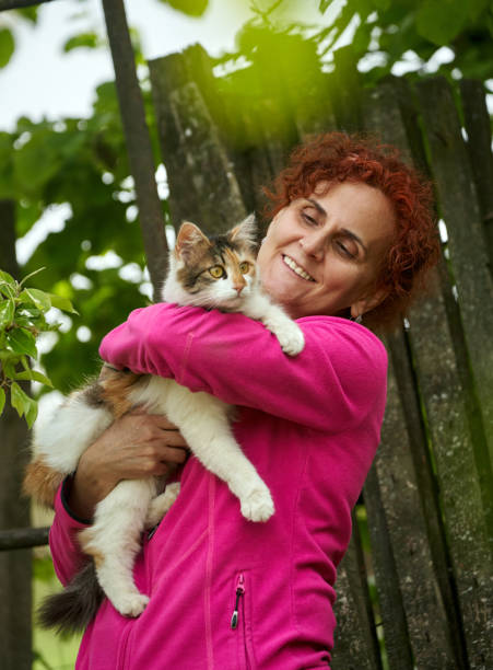 istock Woman holding her cat 1239466644