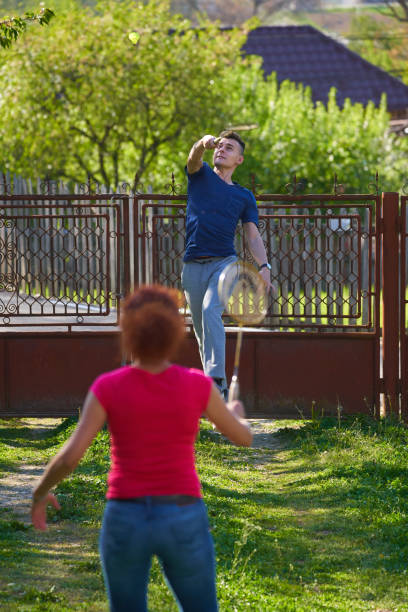 istock Playing badminton in the countryside 1239467201