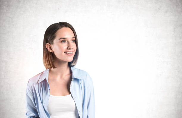 istock Smiling young casual woman, mock up 1239473561