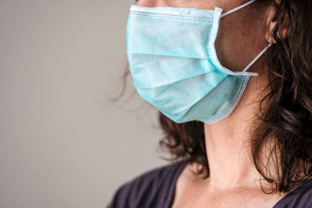 istock Woman wearing a protection mask 1239474836