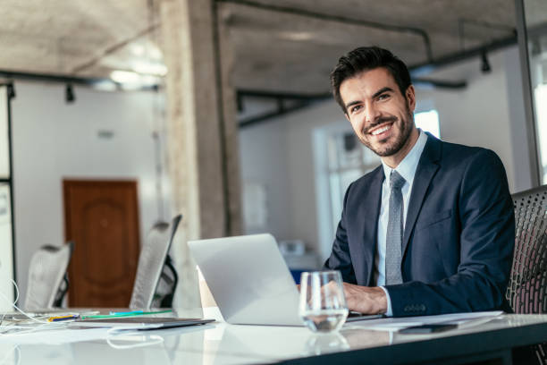 istock Young businessman working at office 1239479608