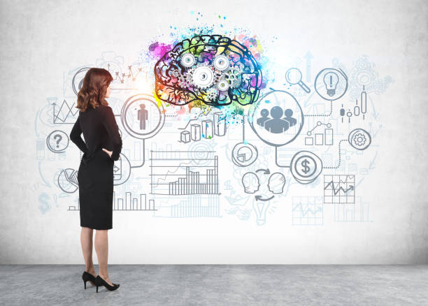 istock Woman looking at business sketch, brainstorming 1239480128
