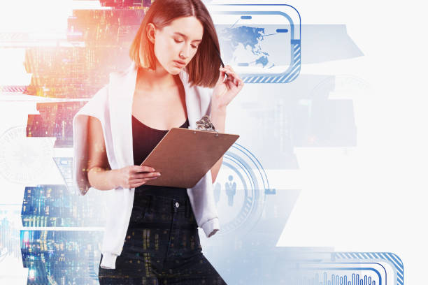 istock Woman with clipboard in city, business interface 1239488780