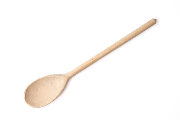 istock Wooden spoon on isolated white background 1239490945