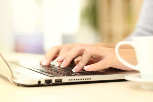istock Woman hands typing on laptop keyboard at home 1239514835