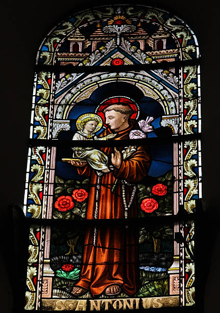 Saint Antonius Saint Antonius or Saint Anthony, stained glass window in the cathedral of Spa, Belgium,. This window was created in the early 19th Century, no property release is required. st anthony of padua stock pictures, royalty-free photos & images