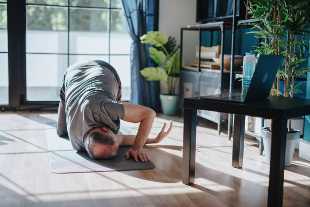 istock Senior man stretching shoulder and upper back region 1239569074