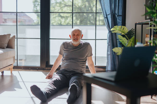 istock Active senior man relaxing after yoga exercises 1239569098
