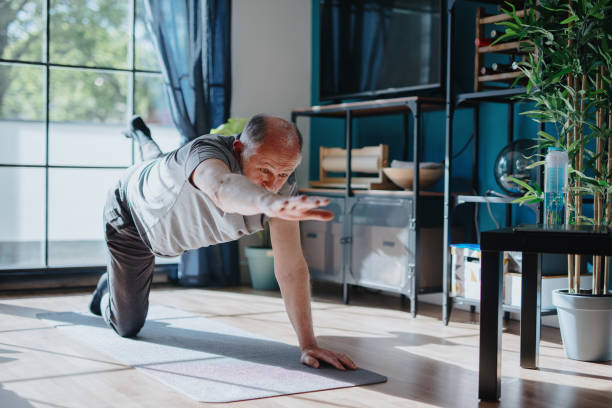 istock Senior man doing balance exercise 1239569428