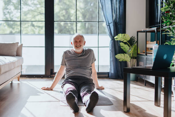 istock Senior man relaxing after hard yoga workout 1239570703