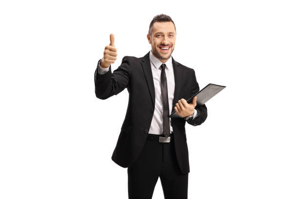 istock Businessman with a clipboard and documents showing thumbs up 1239590601
