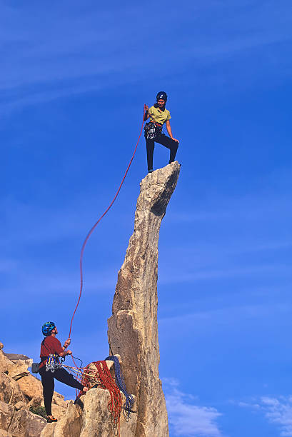 istock Team of climbers reaching the summit. 123959162
