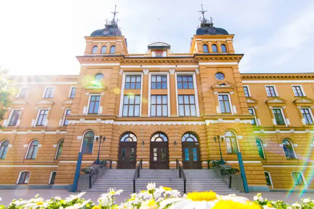 Old yellow Oulu town hall building in the summer