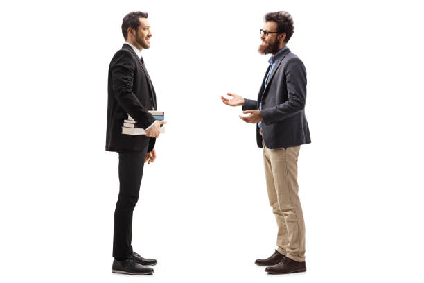 istock Ttwo male teachers standing and talking 1239604823