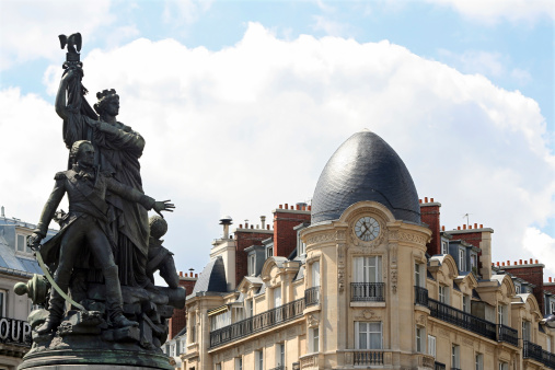 Composition of retro elements: 19th century architecture and a freedom statue. The location is Place de Clichy (Paris, France).