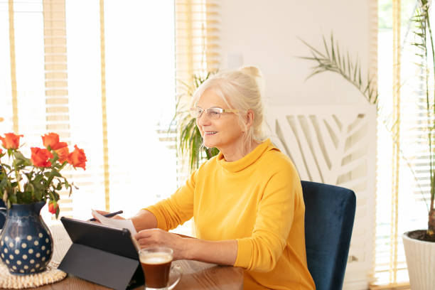 istock Senior woman working at home. 1239629637