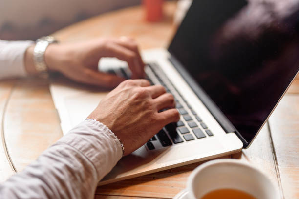 istock Successful manager working in coffee shop during break 1239636678