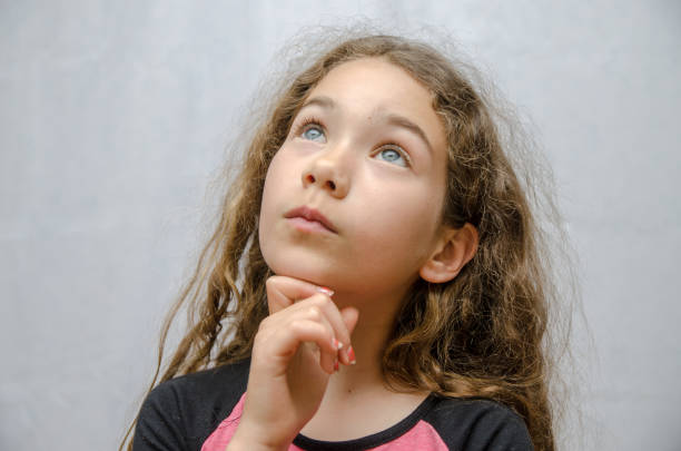 Headshot of Girl thinking on white background