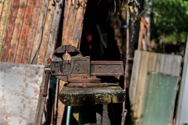 istock Old vise grips on a wooden bench in the backyard 1239643292