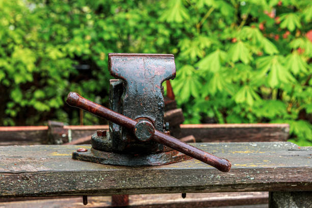istock Old vise grips on a wooden bench in the backyard 1239643581