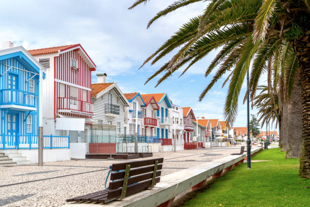 Street with colorful striped houses, Costa Nova, Aveiro, Portugal. Facades of colorful fisheman houses in Costa Nova, Aveiro, Portugal stock photo