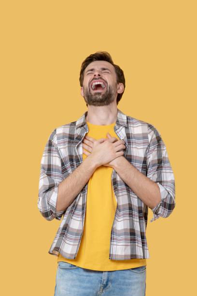 istock Man in plaid shirt and jeans laughs a lot. 1239665554
