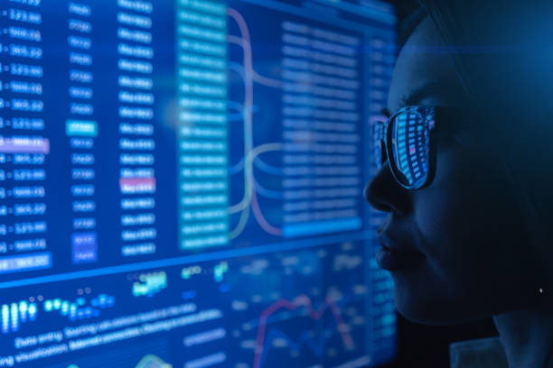istock The young woman looking on a blue screen 1239683355