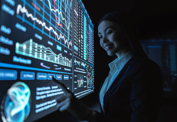 istock The business woman works with graphics on a sensor screen 1239683373