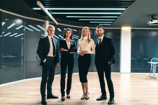 istock The four business people standing indoor 1239686695