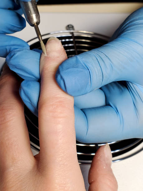 istock Cuticle removal process, hardware nail manicure in a beauty salon 1239687788