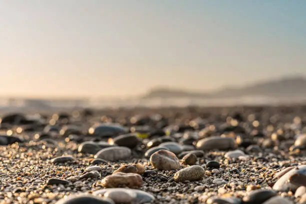 Photo of Close up stone background with blurred sky on the horizon