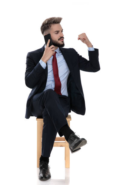 istock excited young businessman talking on the phone 1239700566