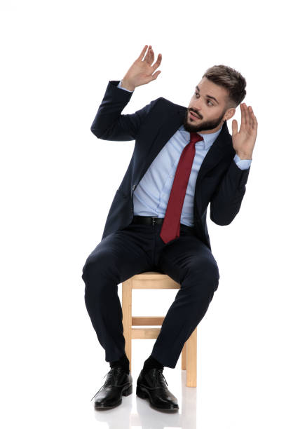 istock scared young businessman holding hands up 1239705862