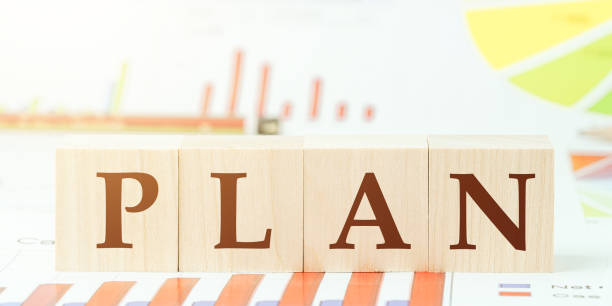 istock word plan of wooden blocks on table with different graphs 1239707079